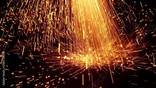 Bright yellow and orange fiery sparks showering down and scattering across a dark surface during an industrial metalworking process.