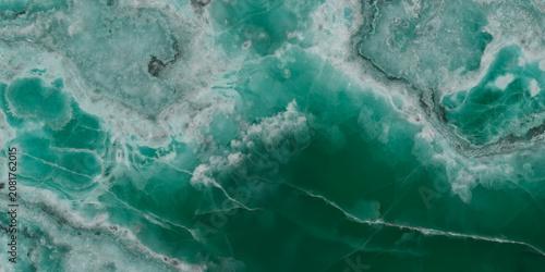 Elegant emerald green onyx marble texture with translucent layers and natural stone veins.