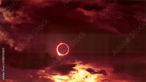 Total solar eclipse ring of fire in dark red sky