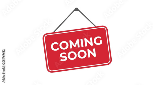 A bright red rectangular coming soon sign hangs from a simple black string against white