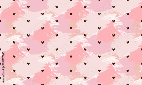 Tiny black hearts on pastel pink watercolor brush stroke background