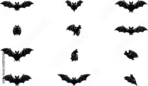 Collection of bat silhouettes in various flying positions silhouette