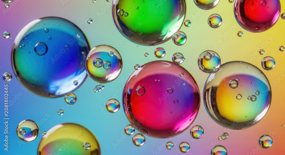 Naklejka premium Rainbow colored oil bubbles, iridescent spheres, colorful liquids, macro photography