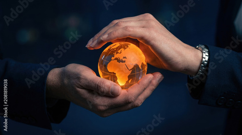 Hand globe light business protection technology network earth held by professional person global connection concept