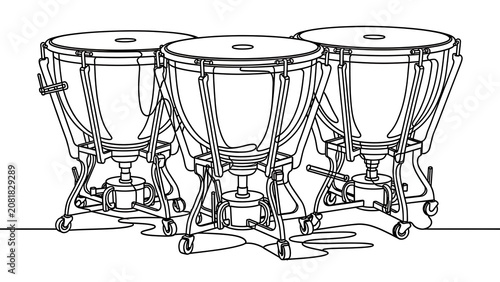 Three timpani drums on white background.