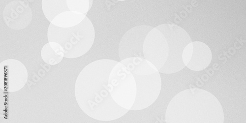 Cuadro en lienzo Elegant white bokeh circles on light gray textured background creating soft out of focus lighting effect for minimalist backdrop