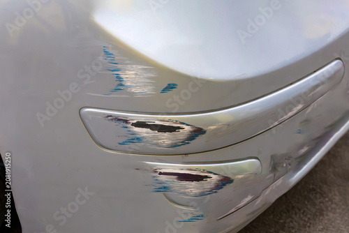 Surface scratches on car bumper damaged on street parking outside