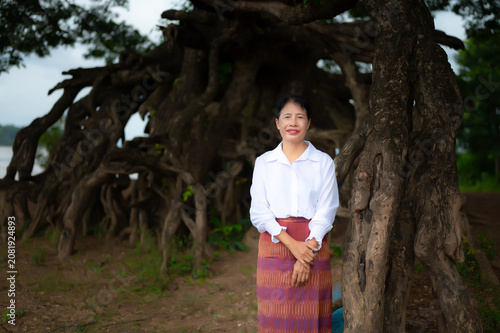 Portrait Photo of Northeastern Thai women with traditional costumes.Thai silk dress concept