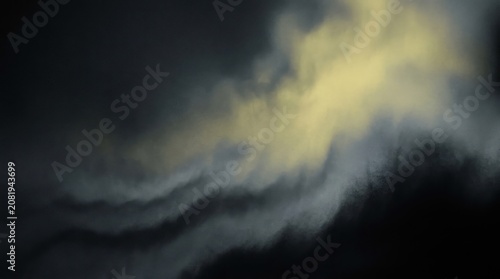 Moody storm clouds over dark sky at dawn
