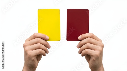 Referee holding yellow and red penalty cards isolated on a white background