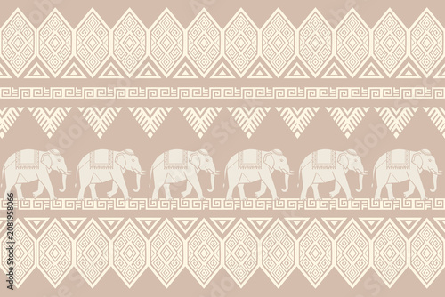 Canvas Print Thai elephant seamless pattern with traditional geometric ikat ornaments on pastel background
