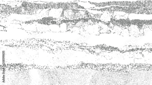 фотографія sedimentary rock cross section with alternating light and dark horizontal layers