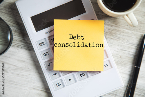 Фотография debt consolidation text on notepad page