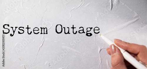 Photos System Outage Investigated: A magnifying glass