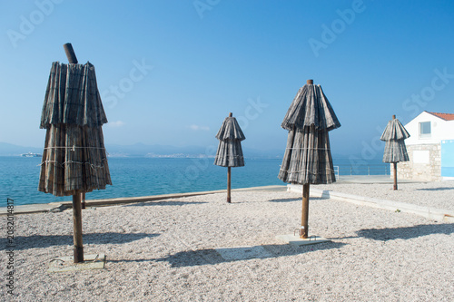Traditional Straw Beach Umbrellas at Kolovare Beach in Zadar, Croatia