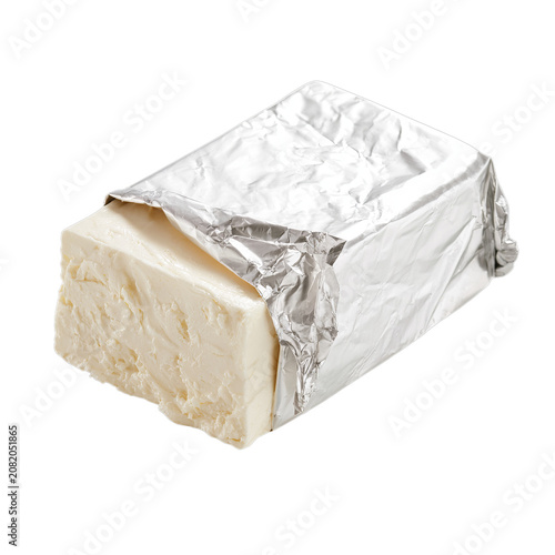 Rectangular block of cream cheese partially exposed from plain silver foil wrapping. Isolated white background. Png format