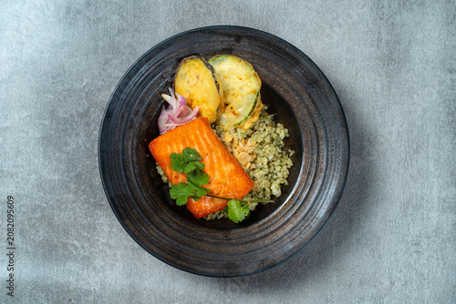 Obraz na plátně Grilled Salmon Herb Rice Bowl with Tempura Vegetables Top View