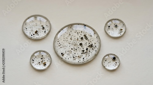Clear cosmetic gel serum drops with small particles illustration
