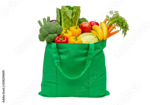 Bright green reusable shopping bag filled with fresh fruits and vegetables isolated on transparent background