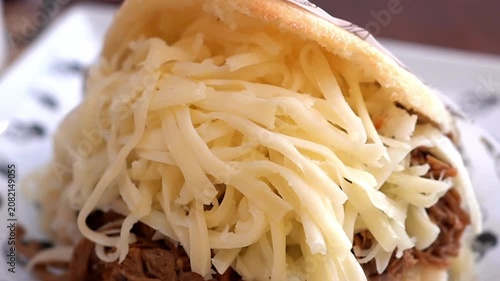 Delicious Arepa Pelua with Oozing Cheese and Meat, Popular Latin American Street Food