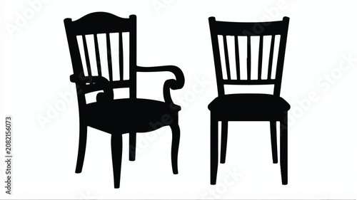 Two black chairs are sitting side by side in a room