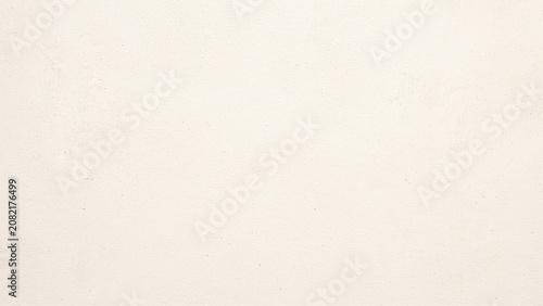 Foto Minimalist beige wall texture background with subtle grainy surface and soft natural lighting, perfect for high-end commercial design projects, clean aesthetic backdrop with empty copy space area