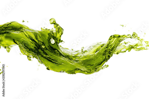 Dynamic green liquid splash in motion isolated on transparent background. Green liquid splash with water droplets isolated on white background.
