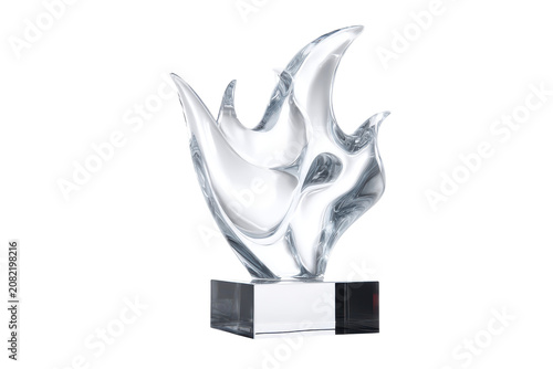 Elegant abstract crystal sculpture on a modern base isolated on transparent background. Crystal glass trophy with flame design isolated on white background.