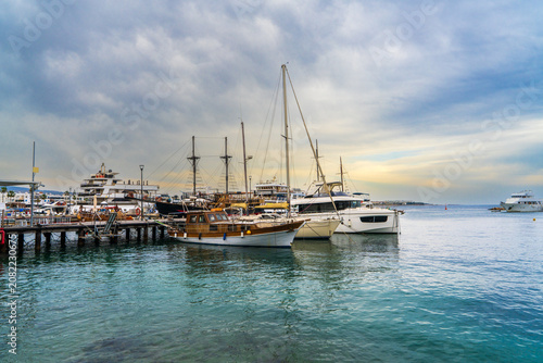 Luxury yachts and sailboats resting in tranquil marina of Latchi, Cyprus. Mediterranean coastal scenery, holiday destination, nautical lifestyle and tourism concept.