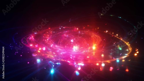 Abstract glowing particles forming a spiral with cinematic motion during night