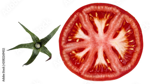 Valokuva Tomato slice shown as a vivid red cross section with visible seeds and detached