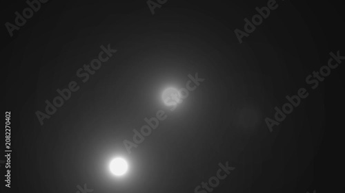 Paparazzi flashes of cameras on a black background. Camera flashes light animation overlay. Cinematic random bright blinking lights. The concept of popularity- Flashing lens flares seamless looping. 