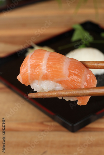 fresh sashimi and sushi served with soy sauce and wasabi