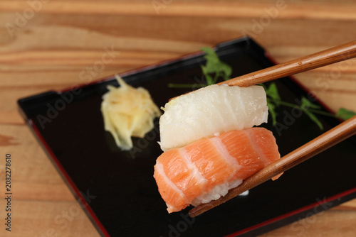 fresh sashimi and sushi served with soy sauce and wasabi