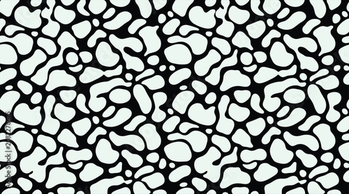 Photos Seamless pattern of irregular amoeba like shapes in pale green on a solid black