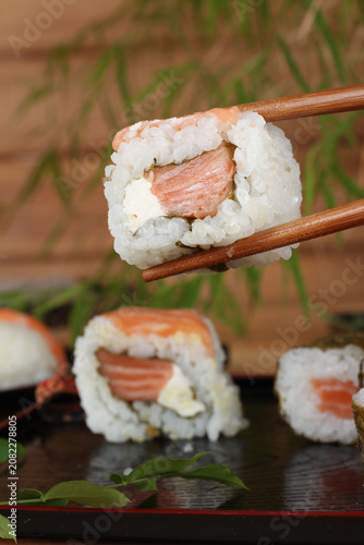 fresh sashimi and sushi served with soy sauce and wasabi
