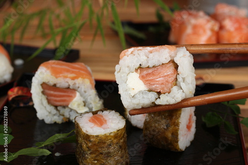 fresh sashimi and sushi served with soy sauce and wasabi