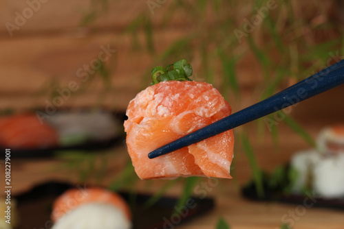 fresh sashimi and sushi served with soy sauce and wasabi