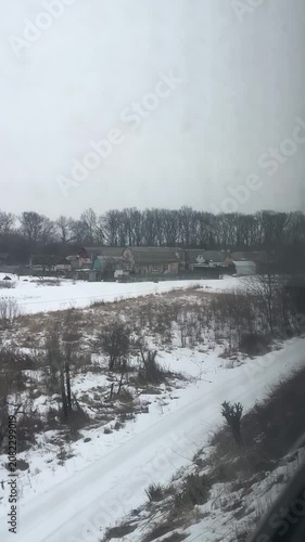 Snowy Landscape Viewed from Moving Train in Winter