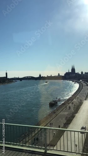 Riverbank and Cityscape with Moving Train View in Daylight