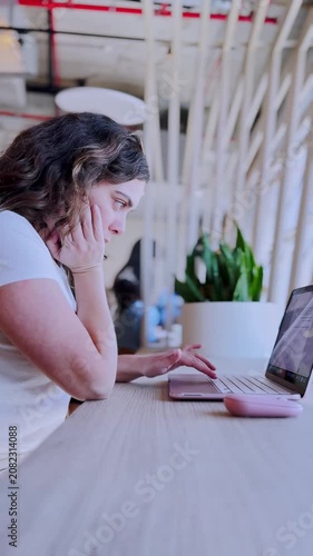 Stressed freelancer experiencing burnout working on laptop