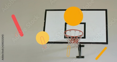 Displaying backboard black border, red rim, net and black bracket hanging on gym wall, graphics