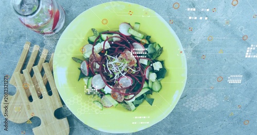 Camera pulling back, revealing yellow salad bowl on tabletop, overlays tagging salad for food ads