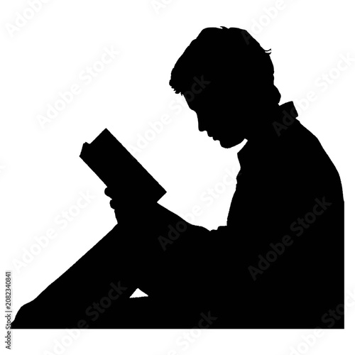 Silhouette of person reading a book