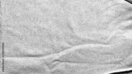 white cotton fabric texture ripples gently under soft cinematic lighting capturing a minimalist sustainable aesthetic