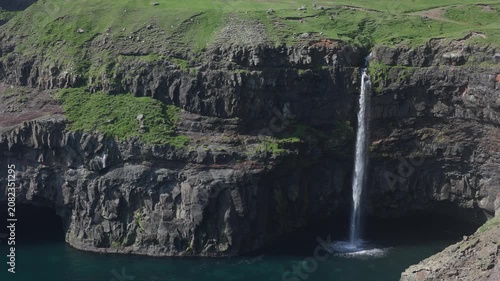 Múlafossur Waterfall on sunny day in Faroe Islands