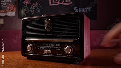 Vintage Radio Tuning with Hand Adjusting Knob
