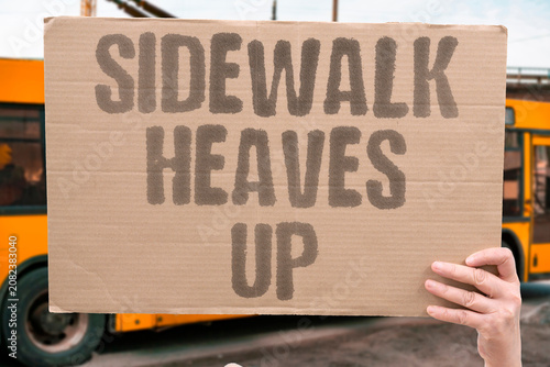 Fotografie "Sidewalk heaves up" Pavement lifts from ground movement