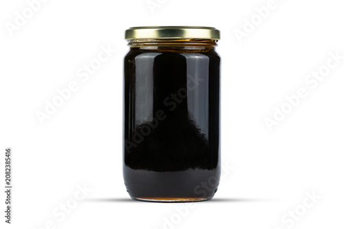 Glass Jar with Dark Syrup Isolated