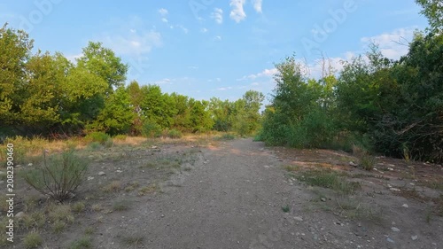 Immersive POV from recumbent trike ride on a rough gravel trails along the Poudre River in Fort Collins, Colorado - summer scenery
